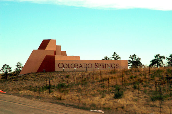 a sign of colorado springs as you are entering colorado springs